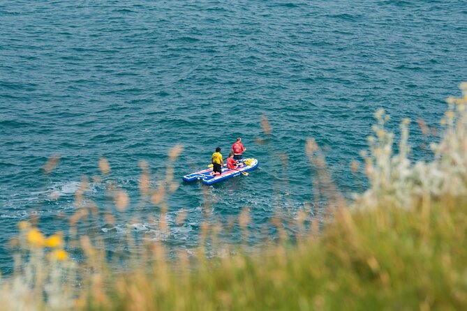 Giant Stand Up Paddle Boarding Experience in Newquay - Price and value for an 83.25 per person giant SUP
