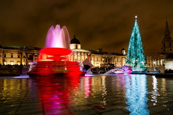 London by Night Bus Tour with Christmas Lights and Live Guide - Piccadilly Circus at night, billboards plus bright holiday energy