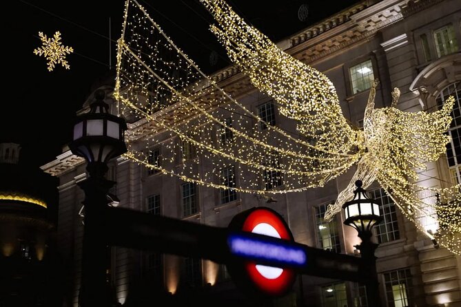 Magical London Christmas Lights Walking Tour with a Londoner - Piccadilly Circus: digital billboards with the lights around them