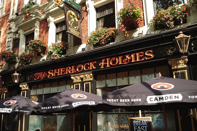 Private Walking Tour: Historic and Hidden Pubs of London - Cittie of Yorke: nooks, wooden booths, and a triangular stove