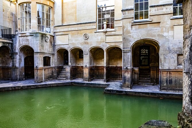 Windsor Castle, Bath and Stonehenge Tour - Roman Baths: the hot spring, torch-light ceremony timing, and the Pump Room